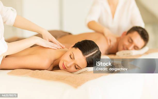 Happy Couple In Spa Salon Having Massage Stock Photo - Download Image Now - Couple - Relationship, Alternative Therapy, Back