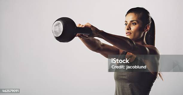 Woman Exercise With Kettle Bell Gym Workout Stock Photo - Download Image Now - Kettlebell, Women, Exercising