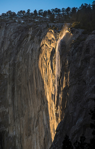 The light before sunset and firefalls created the heart shape around Horsetail Falls at Yosemite National Park