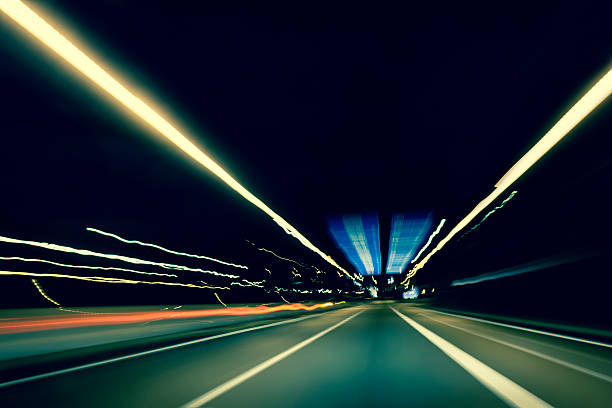 Dark highway at night, with streaks of light Dark highway at night, with streaks of light amsterdam photos stock pictures, royalty-free photos & images