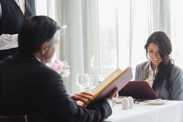 istock Business partners ordering a meal 462580467