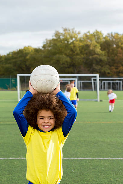 istock Young Boy With Soccer Ball 462580731