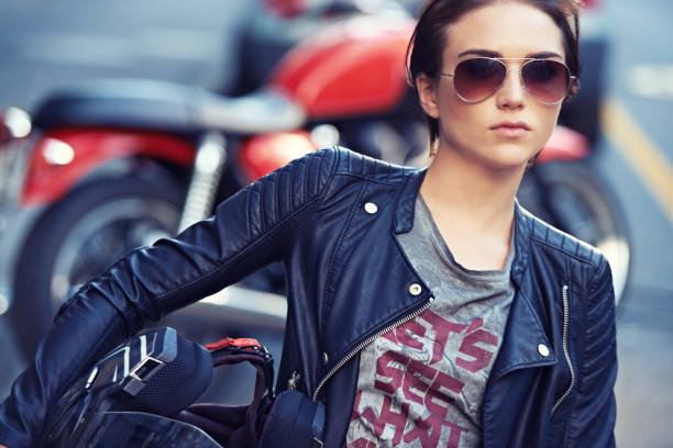 Shot of a young and stylish female motorcycle rider outside