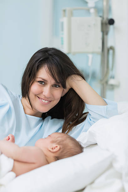 istock Happy mother with her sleeping baby 462581161
