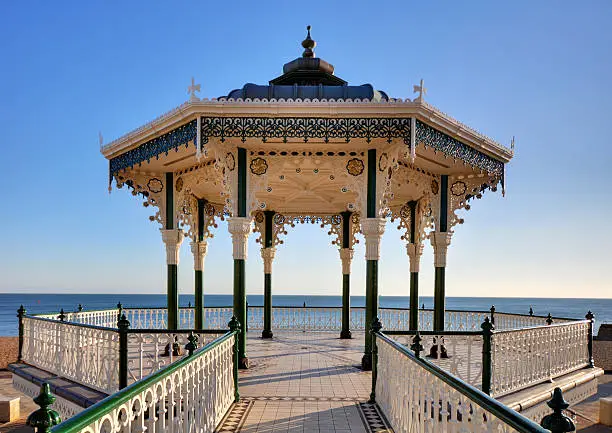 Brighton & Hove's historic Victorian seafront bandstand. After years of neglect it re-opened in summer 2009, having undergone a major restoration project to return the building to its Victorian splendour. In the summer it is regularly used for public concerts and entertainment. The photo has already been lens corrected to remove distortion