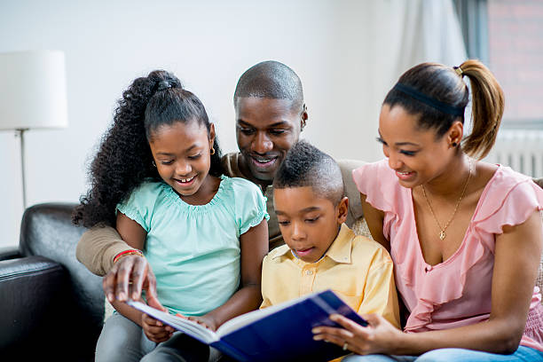 istock Family reading book together 462581551