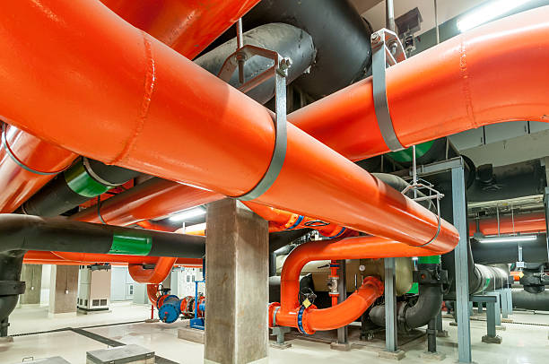 Water pumping station, industrial interior and pipes  .