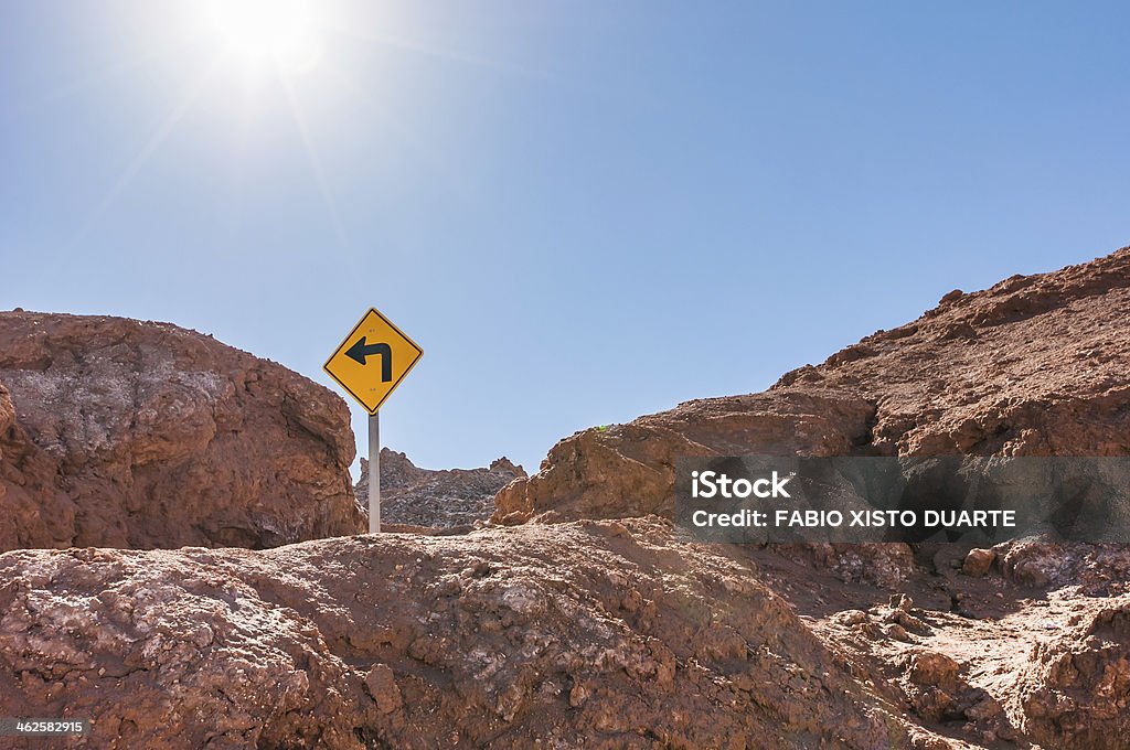 Turn Left - Moon Valley Road sign in the middle of the Atacama Desert. Adventure Stock Photo