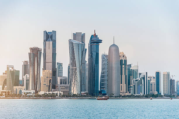 Doha Skyline, Qatar Skyline of Doha, Qatar during sunset. qatar stock pictures, royalty-free photos & images