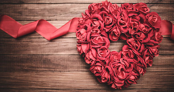 istock wooden heart shape on rustic vintage plank for st. valentine 462586157