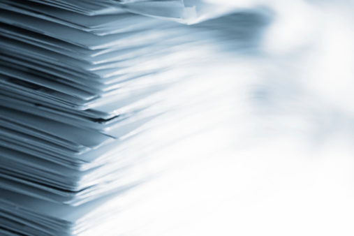 Pile of papers with high key effect