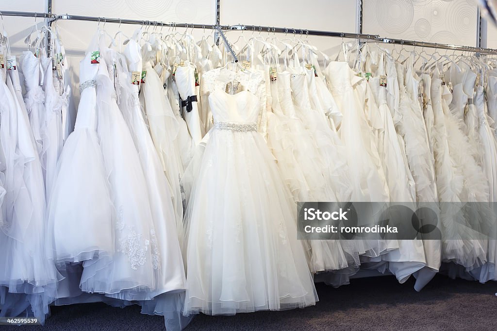Collection of wedding dresses in the shop Collection of wedding dresses in the shop. Beautiful People Stock Photo