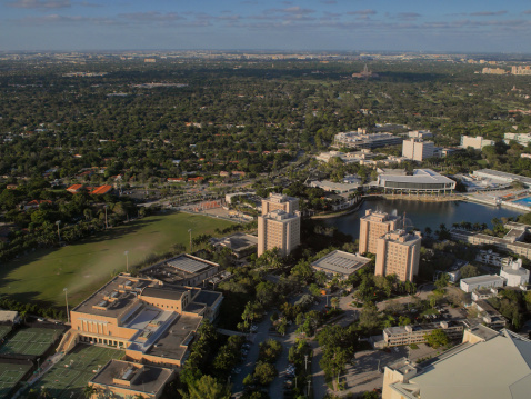 Airial view of the athletic complex and dormitories of the private University of Miami in Coral Gables - a separate city near Miami. The Biltmore hotel can be seen in the far distance.