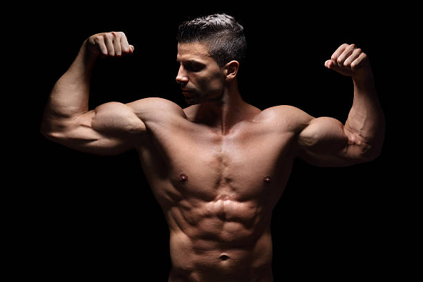 starke männer - men macho flexing muscles shirtless stock-fotos und bilder