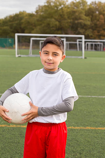 istock Young Boy With Soccer Ball 462601713