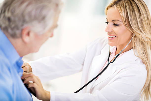 istock Female doctor examining a patient. 462602629
