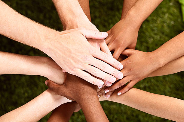 istock We all stand together! Many hands stacked in agreement 462603649