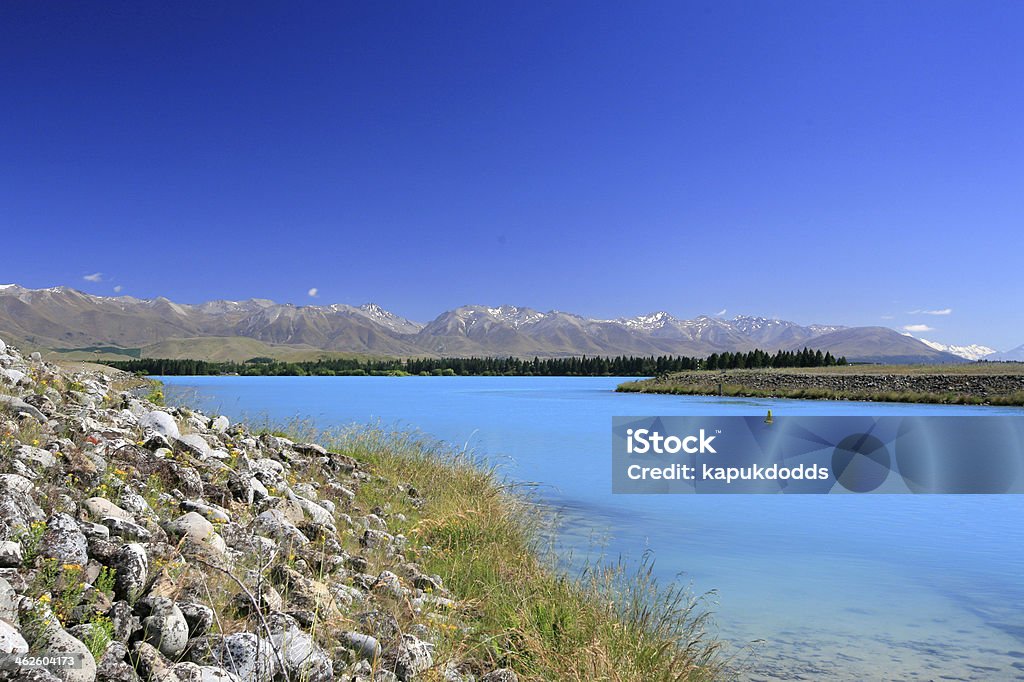 Lake Pukaki and Mount Cook Lake Pukaki and Mount Cook, New Zealand Beach Stock Photo