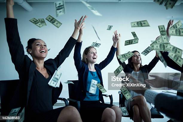 Business People With Arms Raised Throwing Money In The Air Stock Photo - Download Image Now