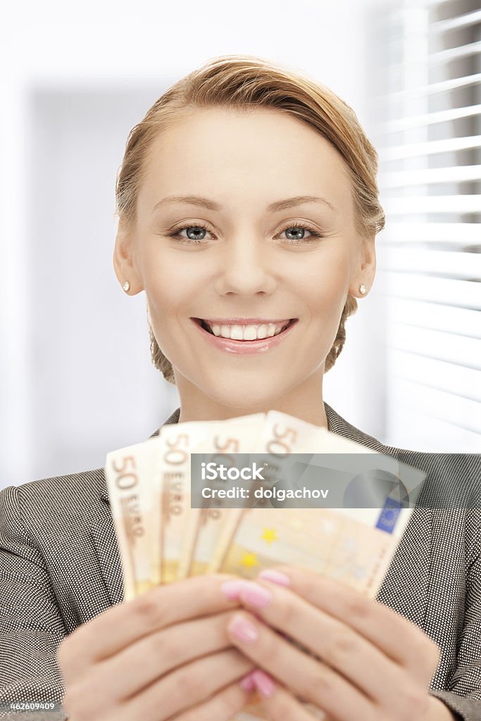 smiling lovely woman with euro cash money people, business, finance and saving concept - smiling woman with euro cash money at office Achievement Stock Photo