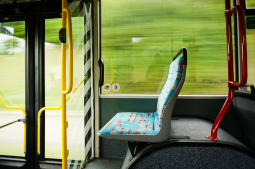 empty seat in a trolley bus. blurred background
