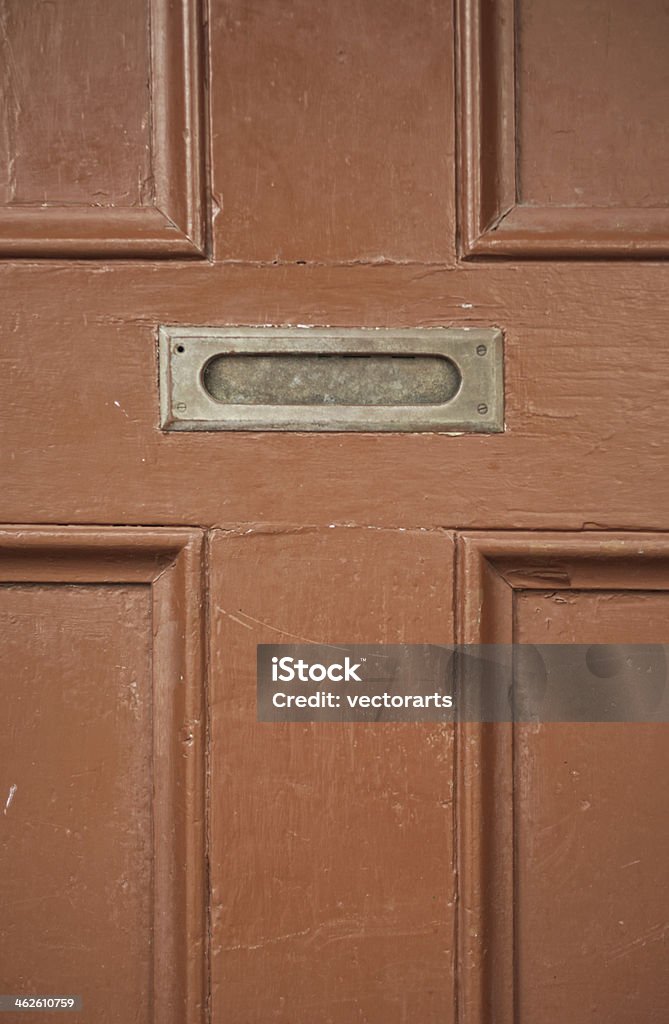 mail slot old fashioned mail slot in old door Brown Stock Photo