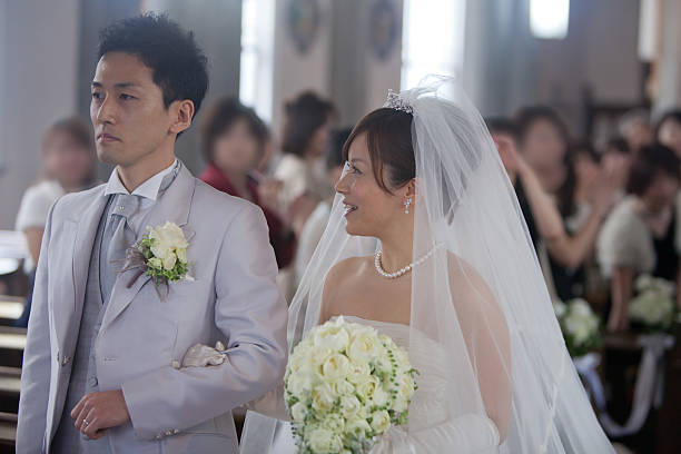 istock Bride smiling at groom in wedding ceremony 462610961