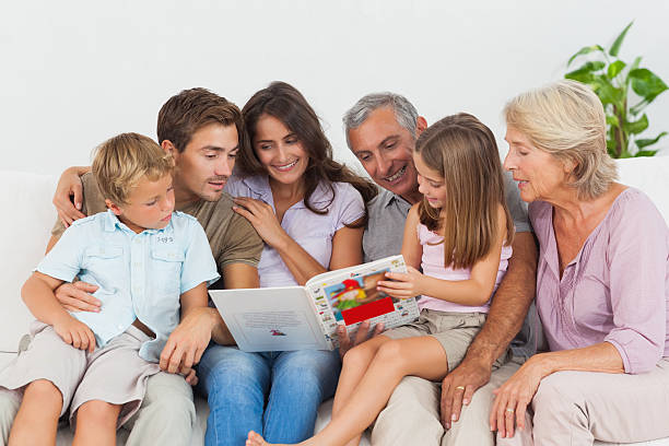 istock Happy family reading a story 462617075