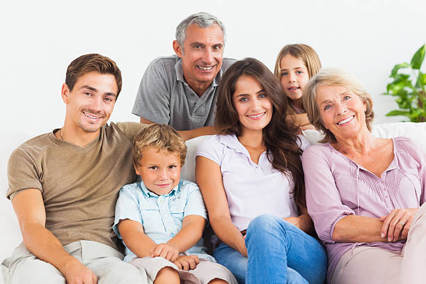 istock Family smiling and looking at camera 462617093