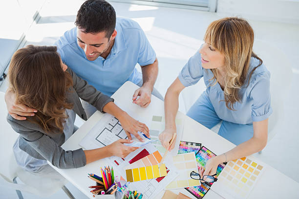 istock Overview of couple chatting with an interior designer 462618037