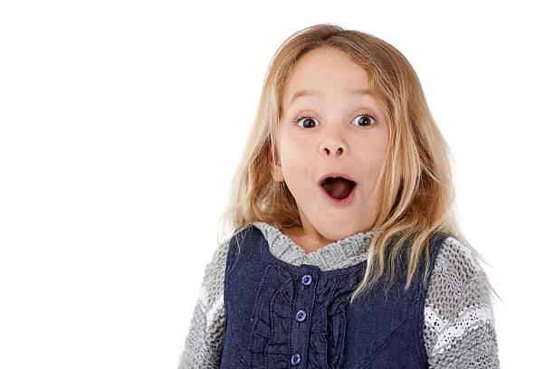 Oh wow!!! Studio portrait of a surprised-looking little girl 6 7 years stock pictures, royalty-free photos & images