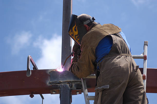 istock One Male Welder, on Ladder, Working With Steel 462628107