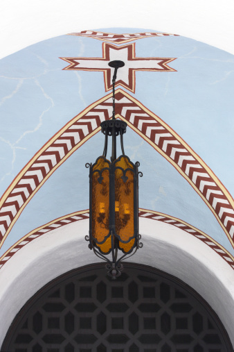 Ornate arched ceiling architecture and light fixture at San Gabriel mission. San Gabriel, California, 2013.