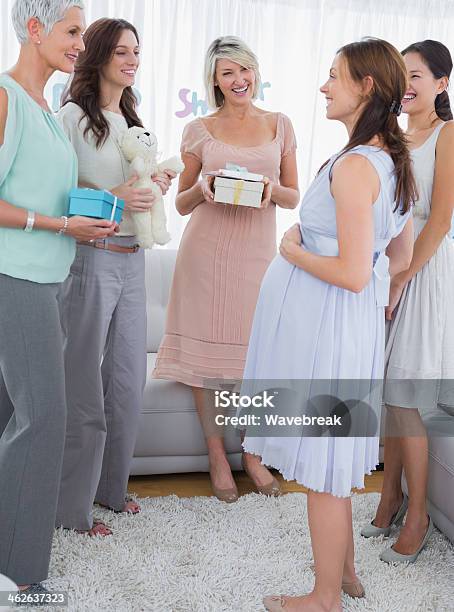 Pregnant Woman Talking To Her Friends At Baby Shower Stock Photo - Download Image Now