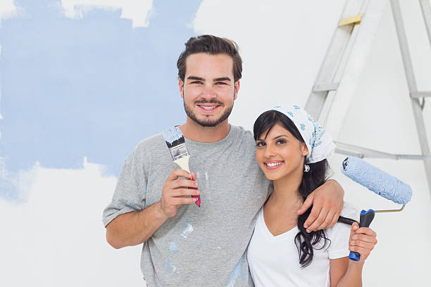 istock Smiling couple in front of their wall 462637697