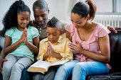 istock black family praying together 462640743