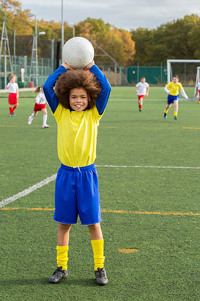 istock Young Boy With Soccer Ball 462640959