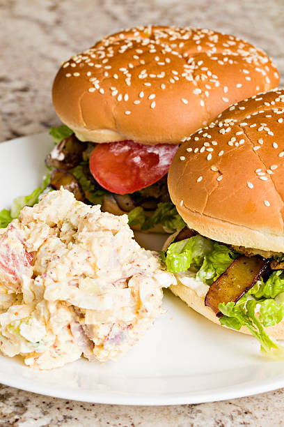 istock Two Hamburgers And Potato Salad 462643625
