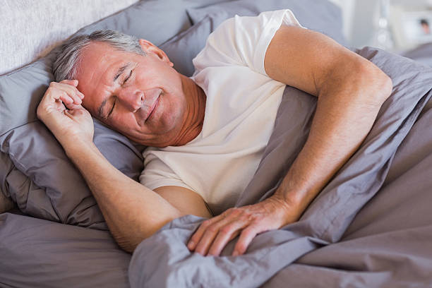 istock Mature man sleeping in his bed 462644713