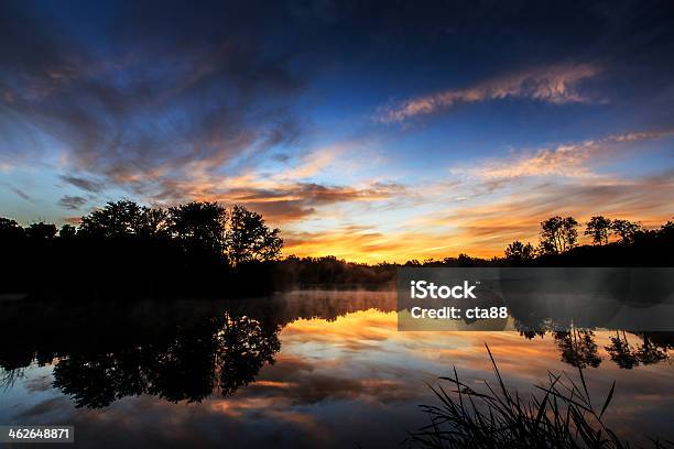 Sunrise Clouds Reflection And Mist On A Lake Stock Photo - Download Image Now - Animal, Autumn, Beauty In Nature