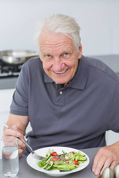 istock Happy mature man eating salad 462648961