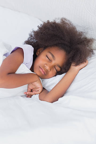 istock Cute little girl sleeping in bed 462649193