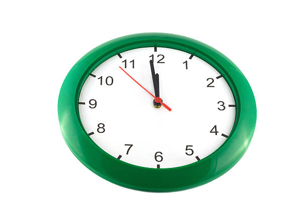 istock Twelve o'clock on round wall watch isolated 462653079