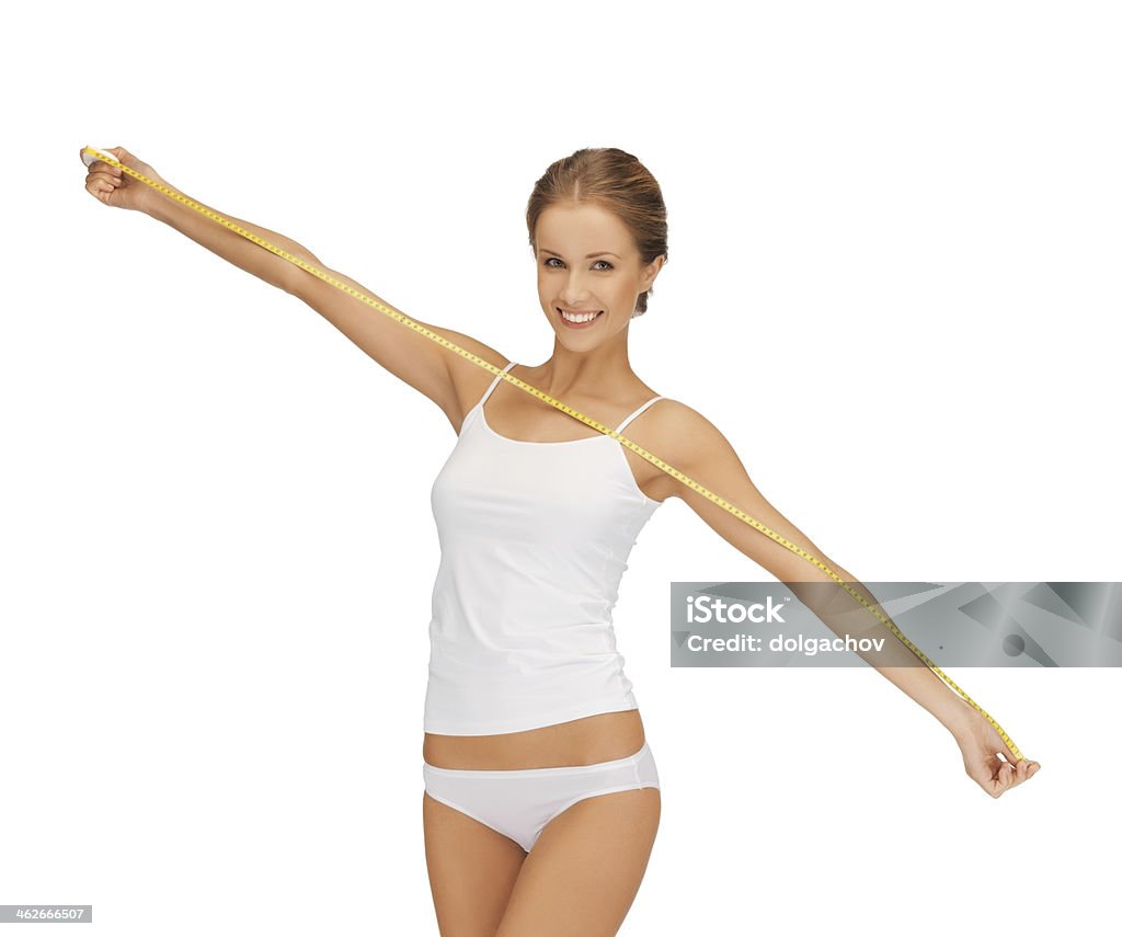 happy young woman with measuring tape people, diet, weight loss and beauty concept - happy young woman with measuring tape Adhesive Tape Stock Photo