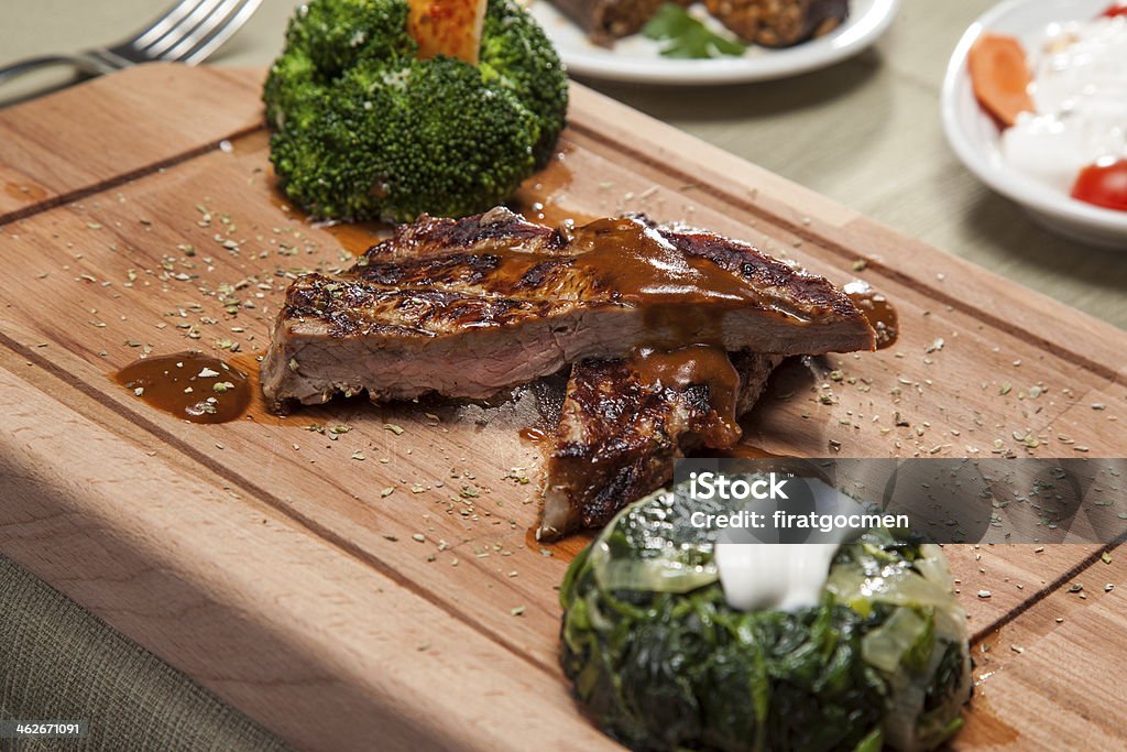 Steak a giant juicy prawn with a giant hunk of juicy steak. Shallow dof Barbecue - Meal Stock Photo