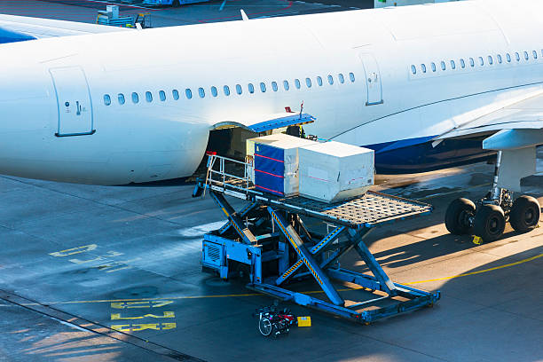 Loading Cargo to Airplane stock photo