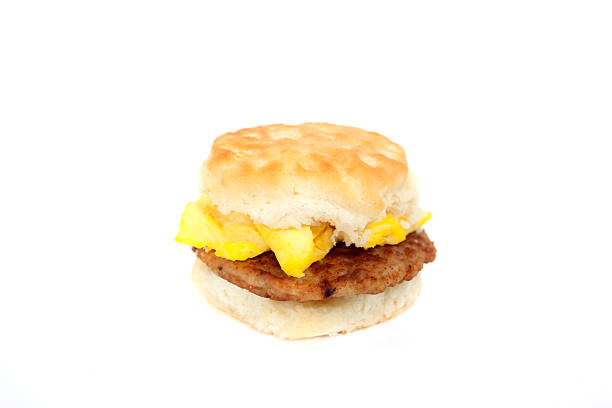 Breakfast Sandwich Sausage and egg biscuit. biscuit quick bread stock pictures, royalty-free photos & images