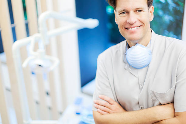 istock Portrait looking at camera of dentist in his office. 462672001