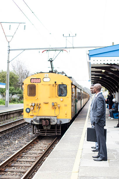 istock African businessmen standing while the train arrives. 462672519