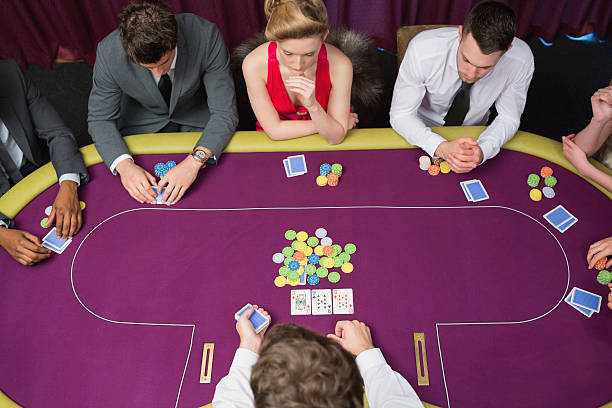 istock People playing at the poker table 462674773